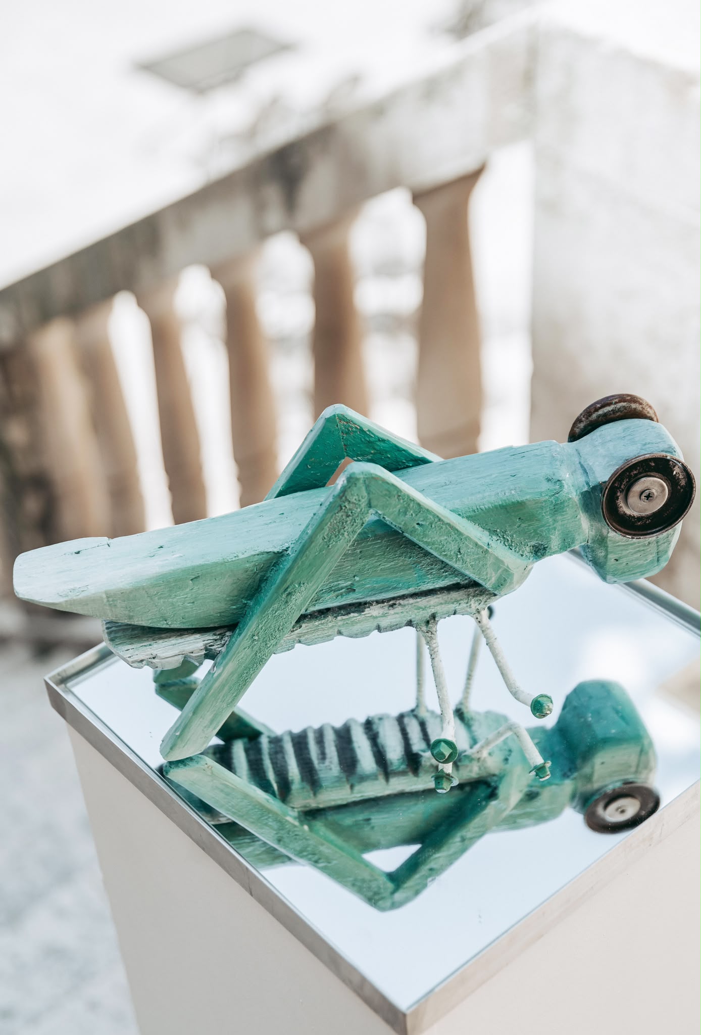 Handmade artistic jewellery displayed in a glass gallery case